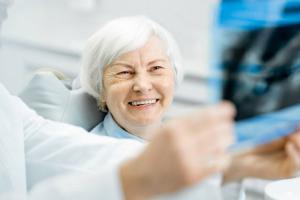 Woman being shown dental x-ray